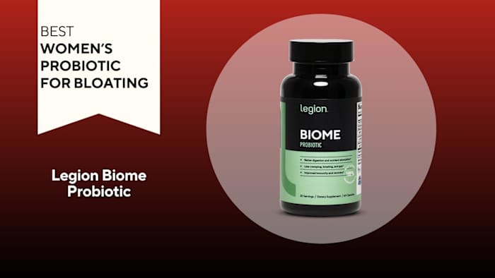 A red background with a white banner that says, "Best Women's Probiotic for Bloating" next to a black and green bottle of Legion Biome Probiotic